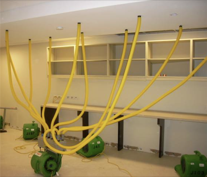 Equipment drying a room.